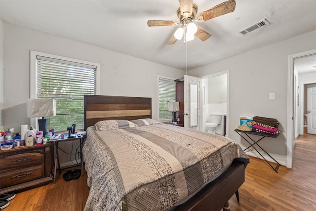 2310 Pecos St, La Marque, TX 77568 - bedroom with multiple windows, ensuite bathroom, visible vents, and wood finished floors