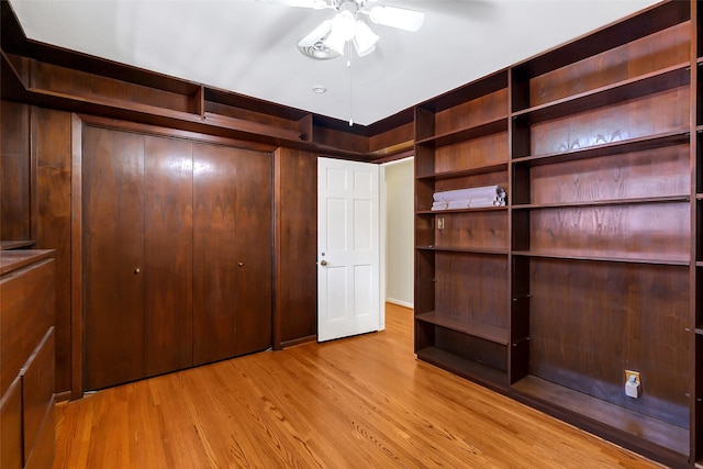 spacious closet featuring ceiling fan and wood finished floors