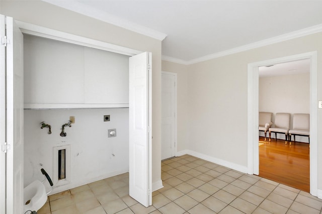 laundry room featuring electric dryer hookup, crown molding, and washer hookup