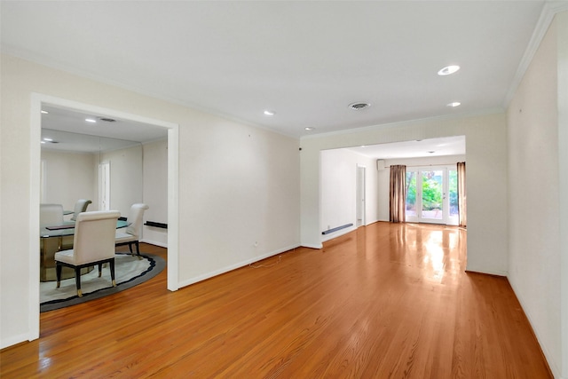 unfurnished room with ornamental molding, light wood finished floors, baseboards, and recessed lighting