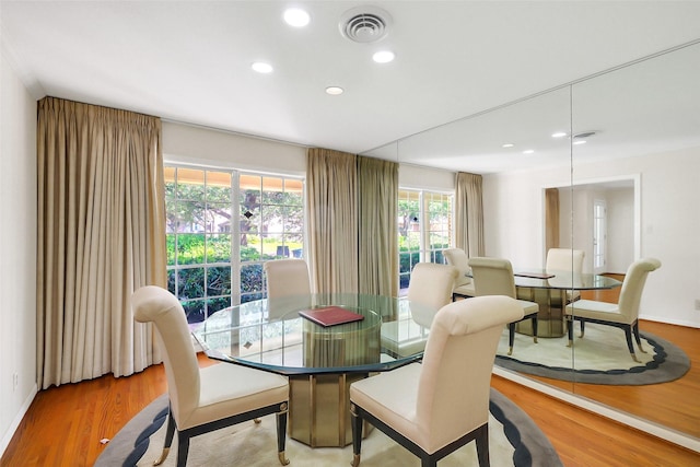 dining area with light wood finished floors, recessed lighting, and baseboards