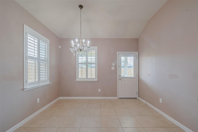 3603 Canvasback Ln, Houston, TX 77047 - unfurnished dining area with a chandelier, light tile patterned floors, and baseboards