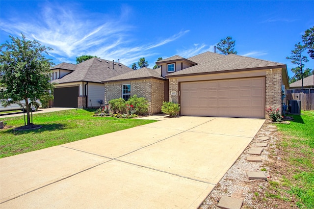 view of front of home featuring concrete driveway, a garage, a front lawn, and brick siding