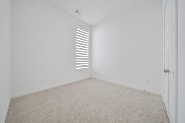 unfurnished room featuring baseboards, carpet flooring, and visible vents