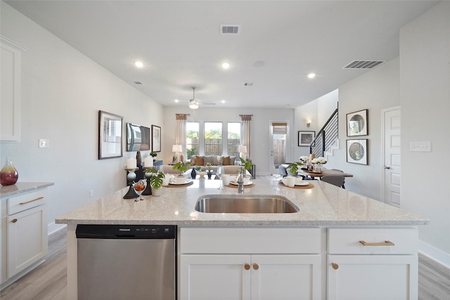 kitchen featuring light wood-style floors, open floor plan, visible vents, and stainless steel dishwasher