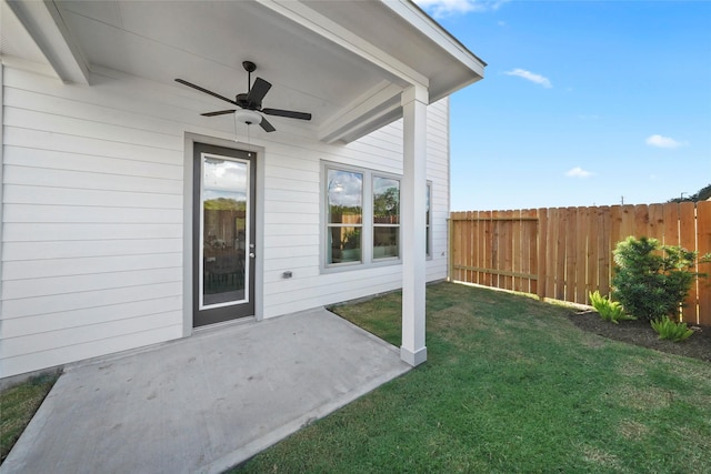 exterior space with a patio area, fence, and ceiling fan