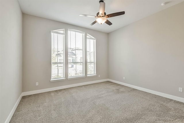 11131 Heartleaf Aster Way, Cypress, TX 77433 - spare room featuring a ceiling fan, a wealth of natural light, baseboards, and light colored carpet
