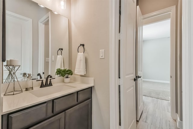11131 Heartleaf Aster Way, Cypress, TX 77433 - bathroom with baseboards and vanity