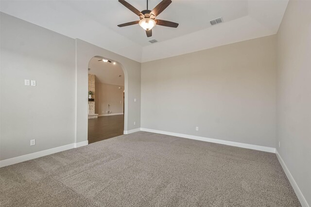 11131 Heartleaf Aster Way, Cypress, TX 77433 - unfurnished room featuring carpet, arched walkways, a ceiling fan, and visible vents
