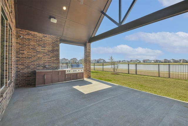 11131 Heartleaf Aster Way, Cypress, TX 77433 - view of patio / terrace with exterior kitchen, a grill, a fenced backyard, and a residential view