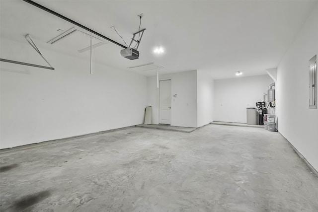 11131 Heartleaf Aster Way, Cypress, TX 77433 - garage featuring electric panel and a garage door opener