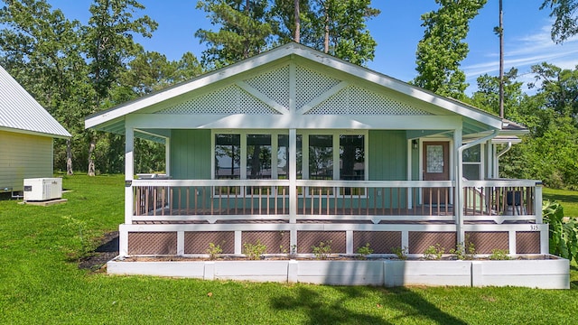 315 Lakeview Hbr, Onalaska, TX 77360 - back of house with covered porch and a lawn