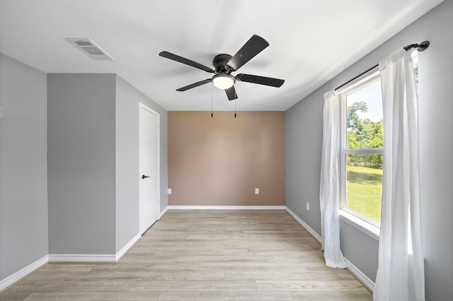 315 Lakeview Hbr, Onalaska, TX 77360 - empty room featuring light wood-style floors, a ceiling fan, and baseboards