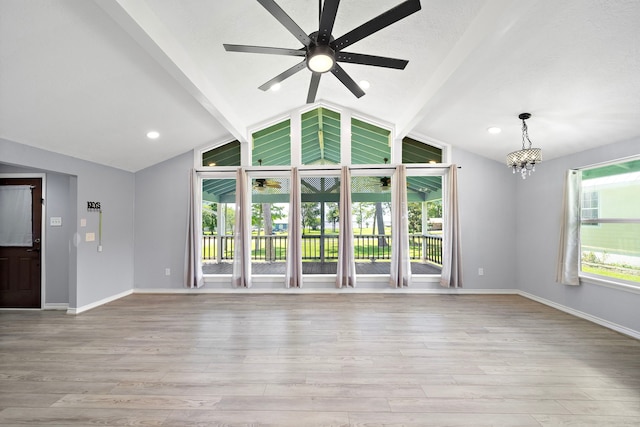 315 Lakeview Hbr, Onalaska, TX 77360 - unfurnished living room with a ceiling fan, light wood-style flooring, a chandelier, and recessed lighting