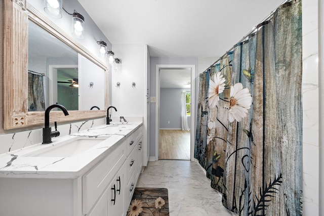 315 Lakeview Hbr, Onalaska, TX 77360 - bathroom featuring marble finish flooring, double vanity, a ceiling fan, and baseboards