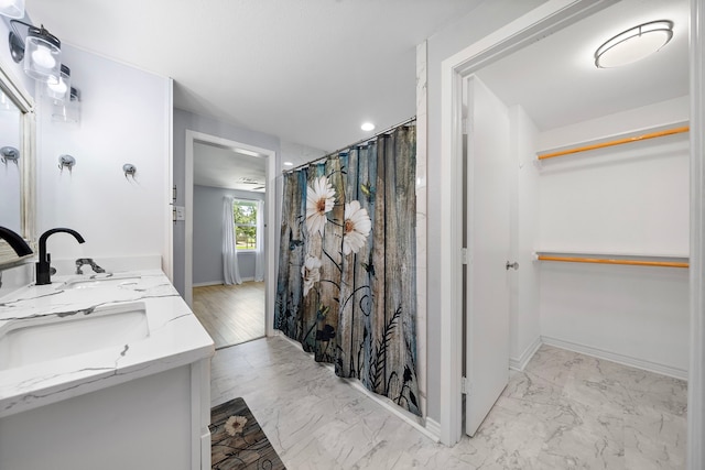 315 Lakeview Hbr, Onalaska, TX 77360 - full bath featuring marble finish floors, baseboards, a spacious closet, curtained shower, and double vanity