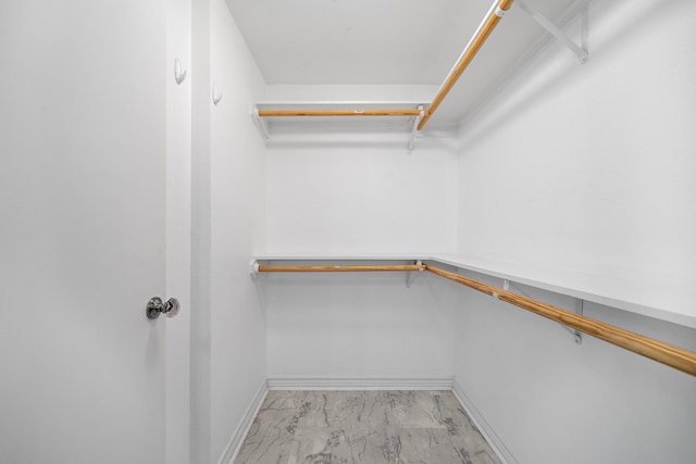 315 Lakeview Hbr, Onalaska, TX 77360 - walk in closet featuring light marble finish flooring