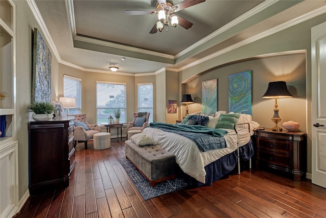 19089 Grandview Pt, Montgomery, TX 77356 - bedroom with a raised ceiling, dark wood-style flooring, ceiling fan, and ornamental molding