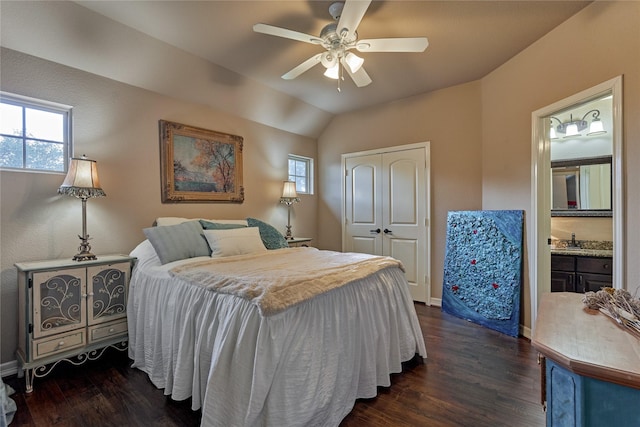 19089 Grandview Pt, Montgomery, TX 77356 - bedroom featuring a closet, dark wood-style floors, a sink, vaulted ceiling, and ceiling fan