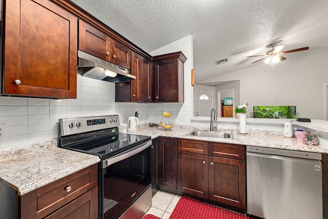 kitchen featuring a sink, stainless steel appliances, visible vents, under cabinet range hood, and vaulted ceiling