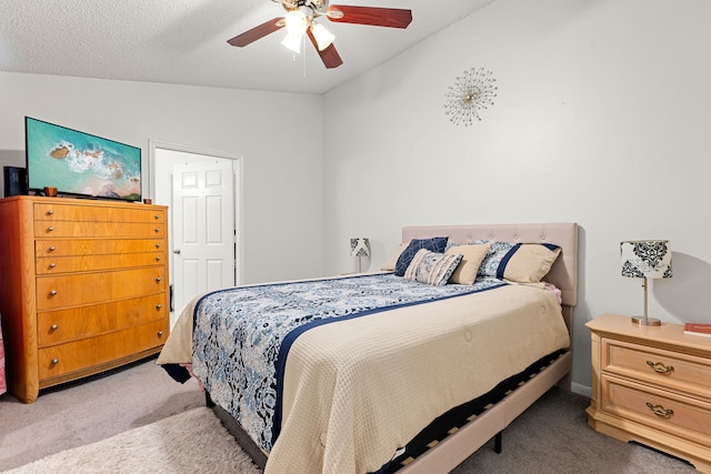 bedroom with light colored carpet, lofted ceiling, and a ceiling fan