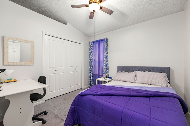 bedroom featuring lofted ceiling, a closet, carpet floors, a ceiling fan, and baseboards
