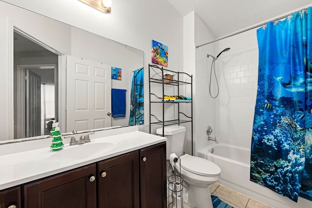bathroom with vanity, toilet, shower / bath combo with shower curtain, and tile patterned floors