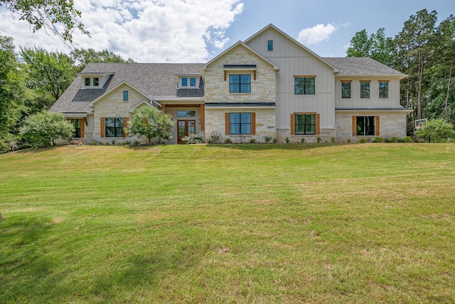 8577 Majestic Lake Ct, Montgomery, TX 77316 - view of front of property featuring stone siding, board and batten siding, and a front lawn