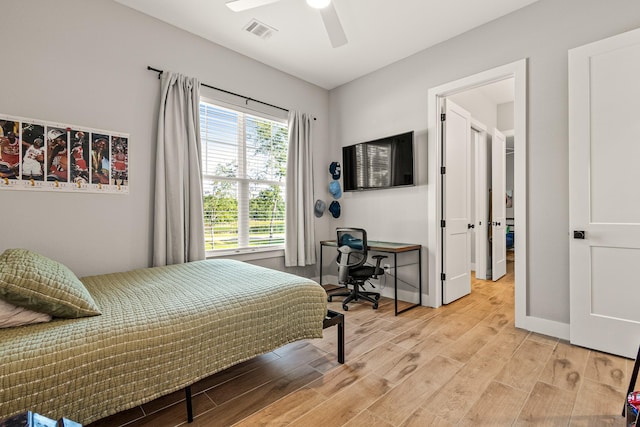 8577 Majestic Lake Ct, Montgomery, TX 77316 - bedroom with light wood finished floors, baseboards, and ceiling fan