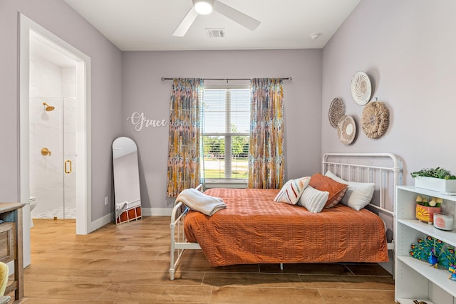 8577 Majestic Lake Ct, Montgomery, TX 77316 - bedroom featuring light wood-type flooring, connected bathroom, a ceiling fan, and baseboards