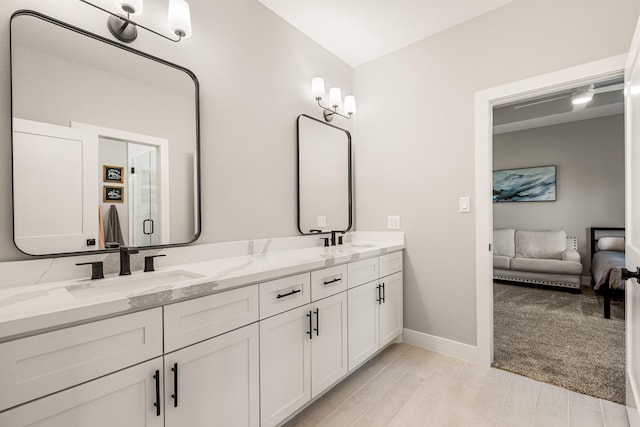8577 Majestic Lake Ct, Montgomery, TX 77316 - full bathroom featuring double vanity, baseboards, and ensuite bathroom