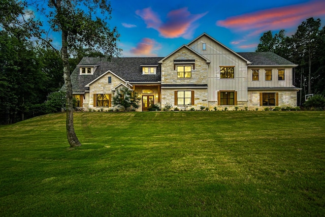 8577 Majestic Lake Ct, Montgomery, TX 77316 - view of front facade featuring stone siding, a front lawn, and french doors