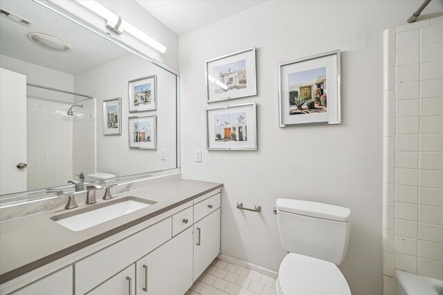167 Litchfield Ln, Houston, TX 77024 - full bathroom featuring toilet, visible vents, baseboards, tile patterned flooring, and vanity