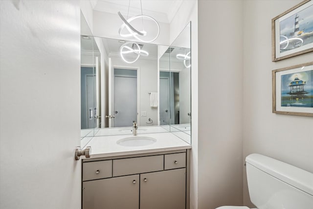 167 Litchfield Ln, Houston, TX 77024 - bathroom with vanity, toilet, and crown molding