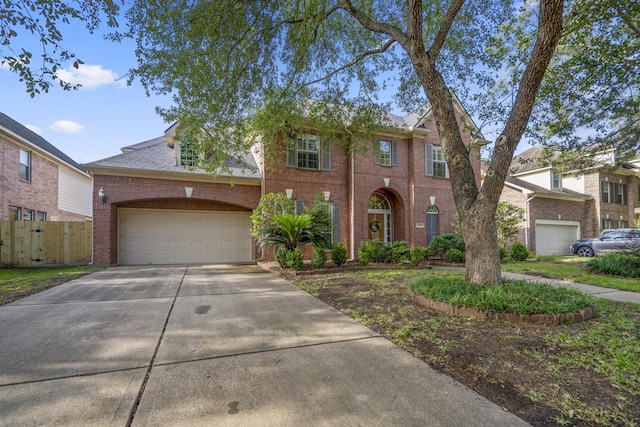view of front facade featuring brick siding, concrete driveway, a garage, and fence