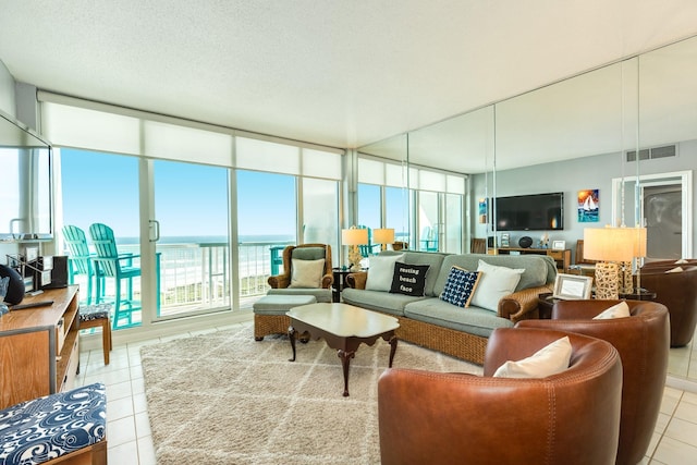 1401 E Beach Dr Unit 811, Galveston, TX 77550 - living room with light tile patterned floors and visible vents