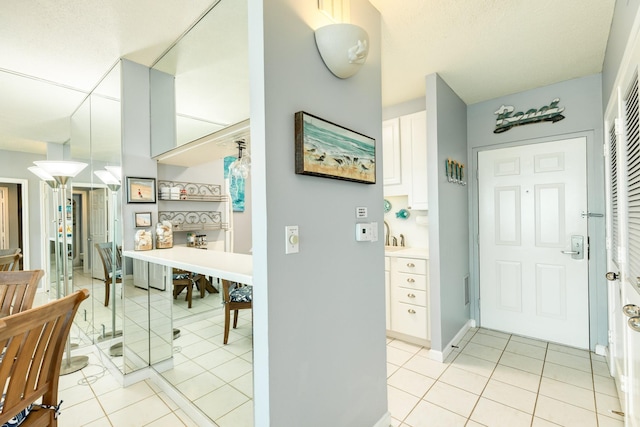 1401 E Beach Dr Unit 811, Galveston, TX 77550 - entryway with light tile patterned floors