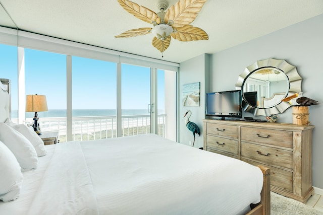 1401 E Beach Dr Unit 811, Galveston, TX 77550 - bedroom with a ceiling fan and access to exterior