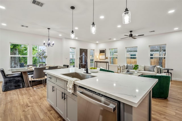 4104 Engelke St, Houston, TX 77003 - kitchen with dishwasher, visible vents, an island with sink, and a sink