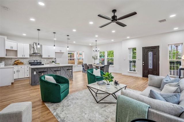 4104 Engelke St, Houston, TX 77003 - living room featuring light wood-style floors, visible vents, and recessed lighting