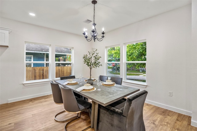 4104 Engelke St, Houston, TX 77003 - dining area featuring an inviting chandelier, baseboards, a healthy amount of sunlight, and visible vents