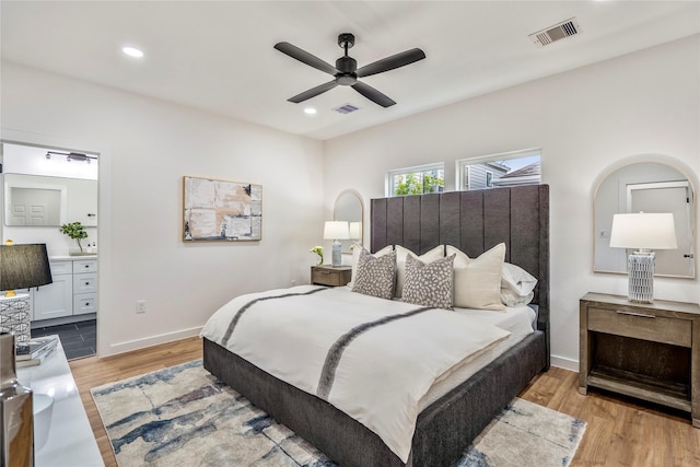 4104 Engelke St, Houston, TX 77003 - bedroom featuring light wood-type flooring, visible vents, baseboards, and ensuite bathroom