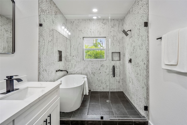 4104 Engelke St, Houston, TX 77003 - bathroom with a stall shower, vanity, tile walls, and a freestanding tub