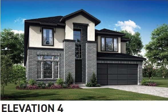 view of front facade with a front lawn, driveway, stucco siding, and an attached garage