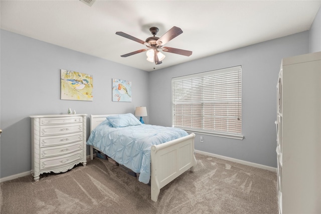 7219 Palisades Heights Dr, Houston, TX 77095 - bedroom with light colored carpet, baseboards, and ceiling fan