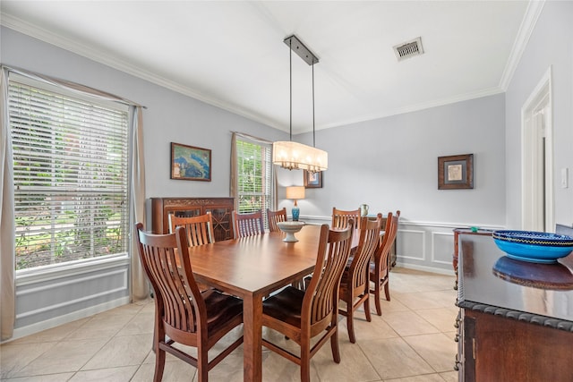 7219 Palisades Heights Dr, Houston, TX 77095 - dining room with light tile patterned floors, crown molding, a chandelier, a decorative wall, and wainscoting