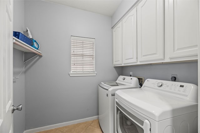 7219 Palisades Heights Dr, Houston, TX 77095 - laundry area with washer and clothes dryer, cabinet space, baseboards, and light tile patterned floors
