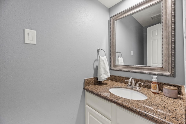 7219 Palisades Heights Dr, Houston, TX 77095 - bathroom with vanity and a textured wall