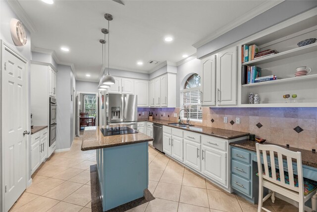 7219 Palisades Heights Dr, Houston, TX 77095 - kitchen with stainless steel appliances, crown molding, a sink, white cabinetry, and plenty of natural light