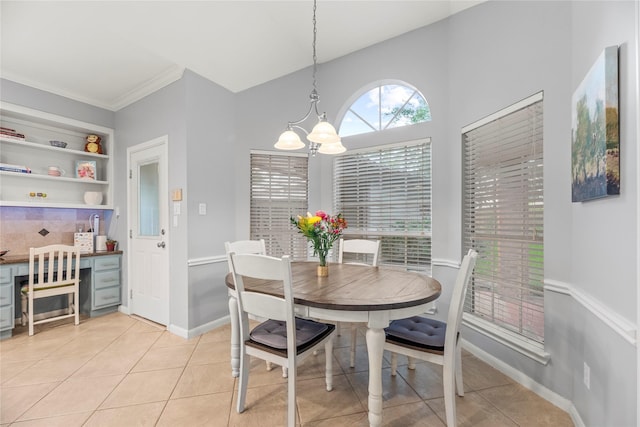 7219 Palisades Heights Dr, Houston, TX 77095 - dining area featuring a chandelier, light tile patterned floors, crown molding, and baseboards